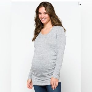 Light grey, long-sleeve maternity shirt. It's very light-weight.